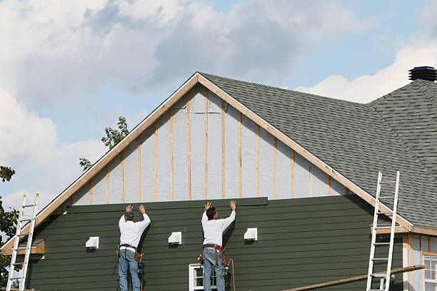 Professional Storm Damage Siding Repair technician working in Colmar, PA